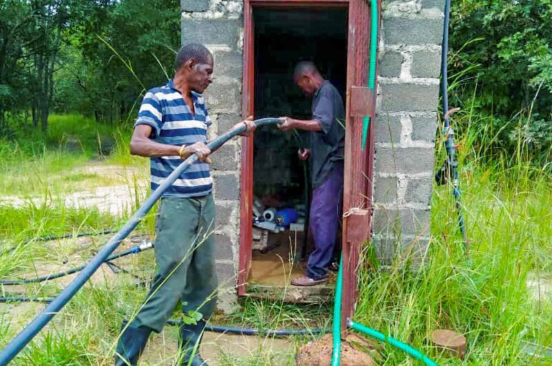 Impact Pump being installed in a covered farm building by two local plumbers